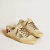 V-Star aus ecrufarbenem Nappa mit silbernem Nappa-Stern und Perlenstickerei