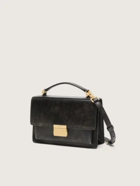Venezia-Tasche aus schwarzem, auf Alt getrimmtem Leder mit goldenen Details