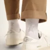 Weisse Socken mit Kristallstern auf der Rückseite