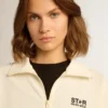Weisses Damen-Sweatshirt mit Reissverschluss, weissem Streifen und schwarzen Sternen