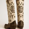 Wish Star-Stiefel aus schwarz-weissem Leder mit eingearbeiteter Rose und Stern